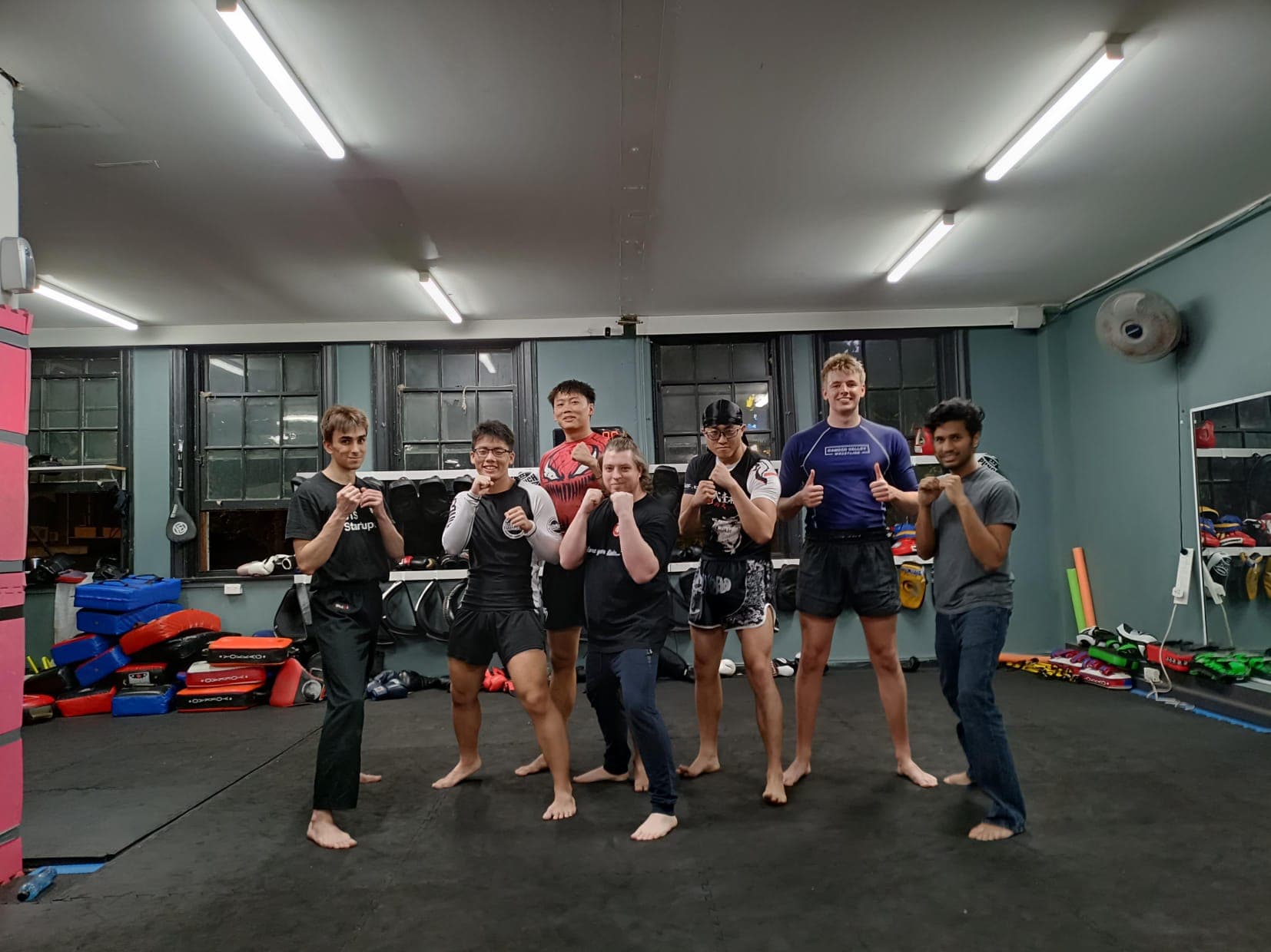 Limitless class lined up in guard stance at the end of a training session