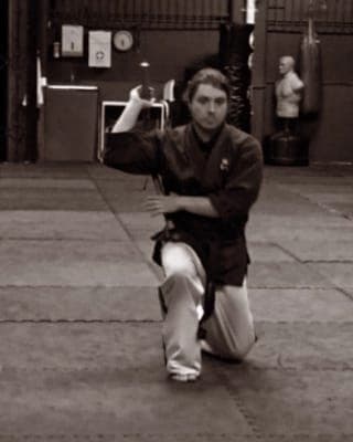 Sensei Brendon in a low kung fu stance during training